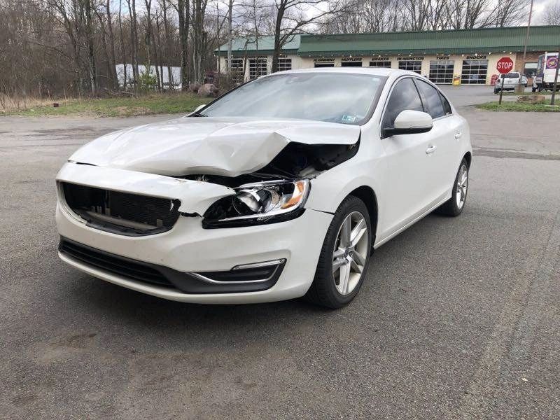 Front-end collision damage being repaired at Finish Line Auto Body