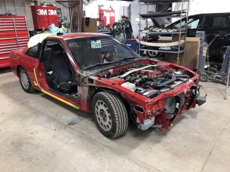 Vehicle frame straightening in progress